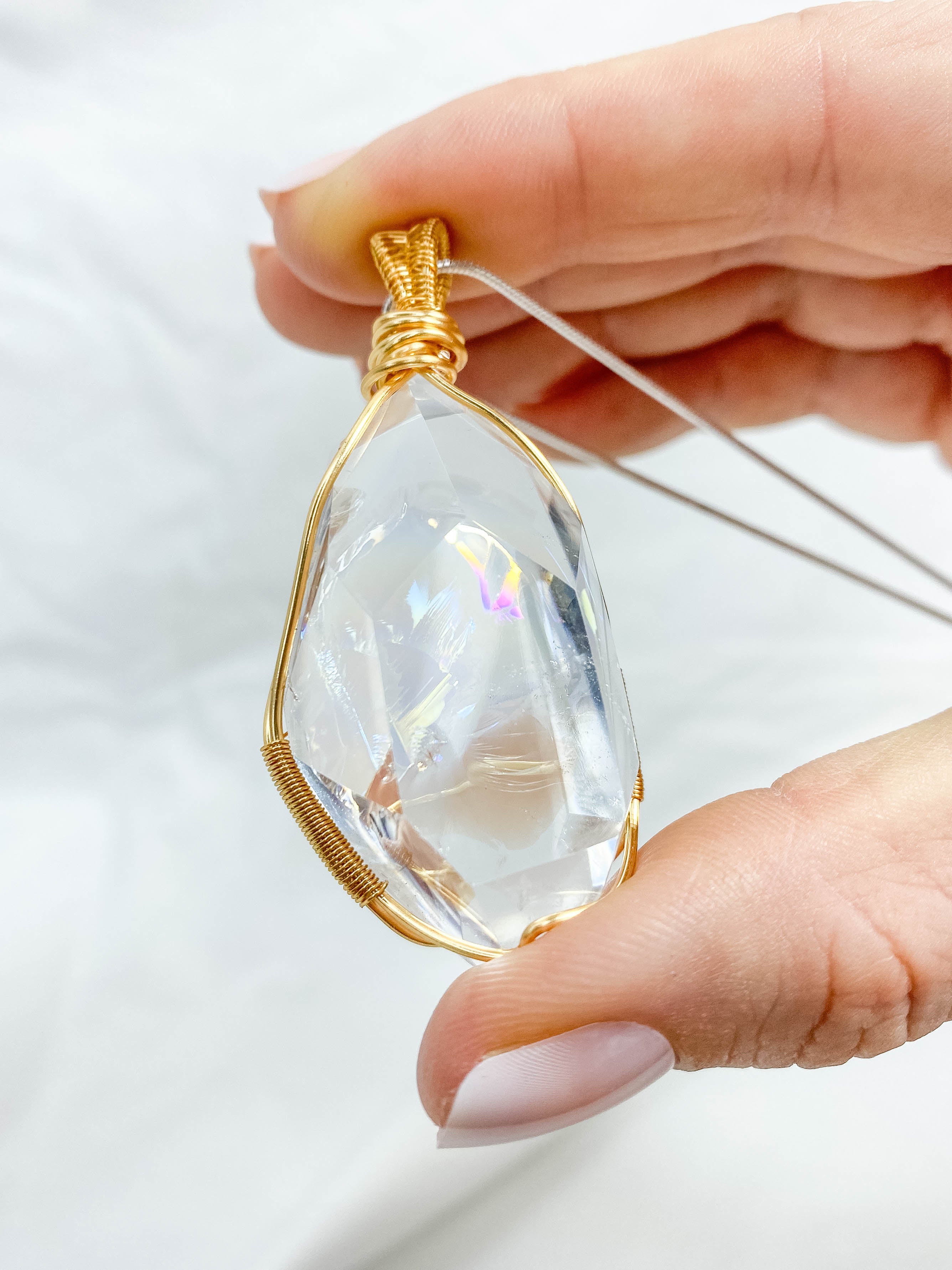 Enchanted Clear Quartz Gold Wrapped Rainbow Pendant